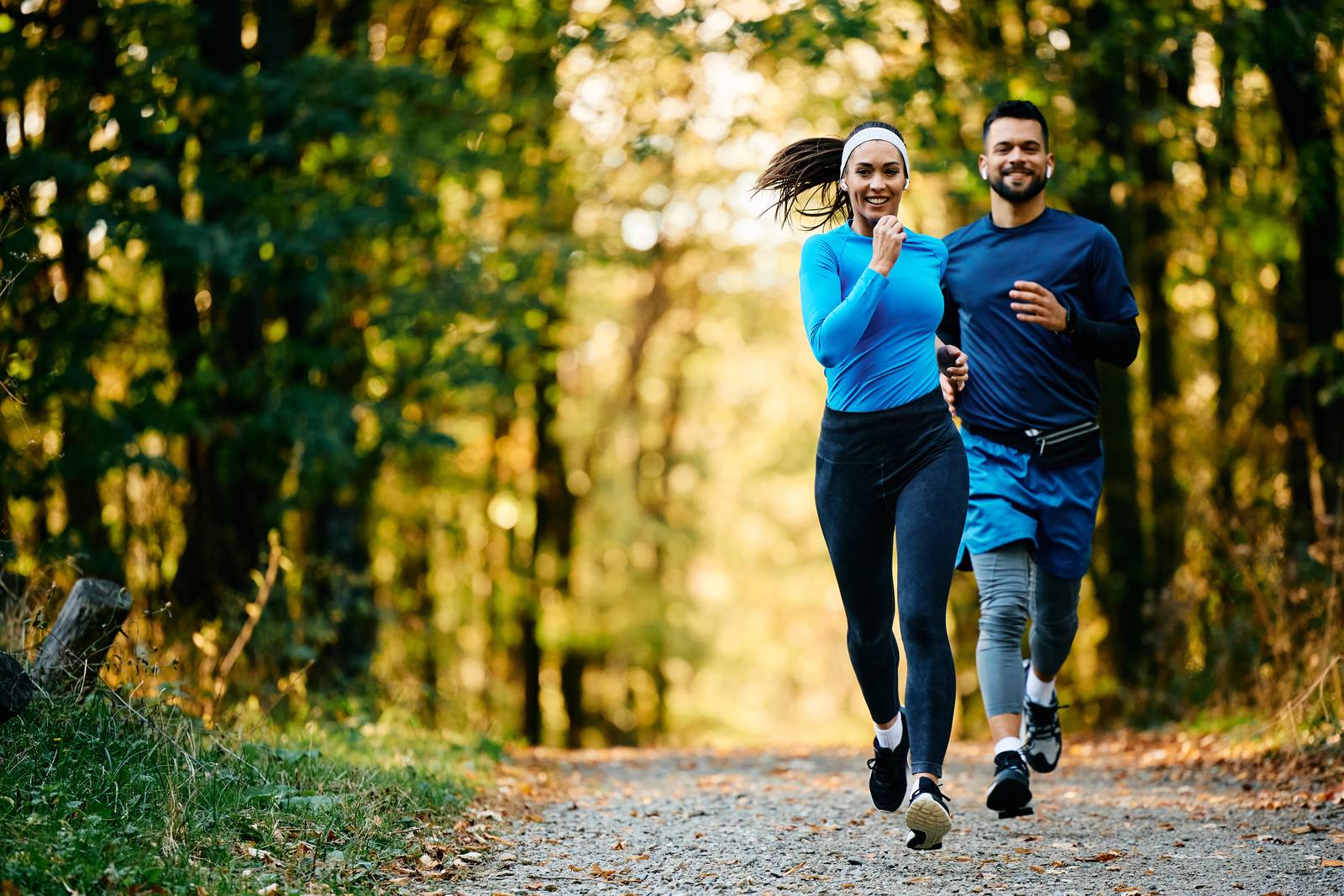 Two Vitora clients running through a forest trail